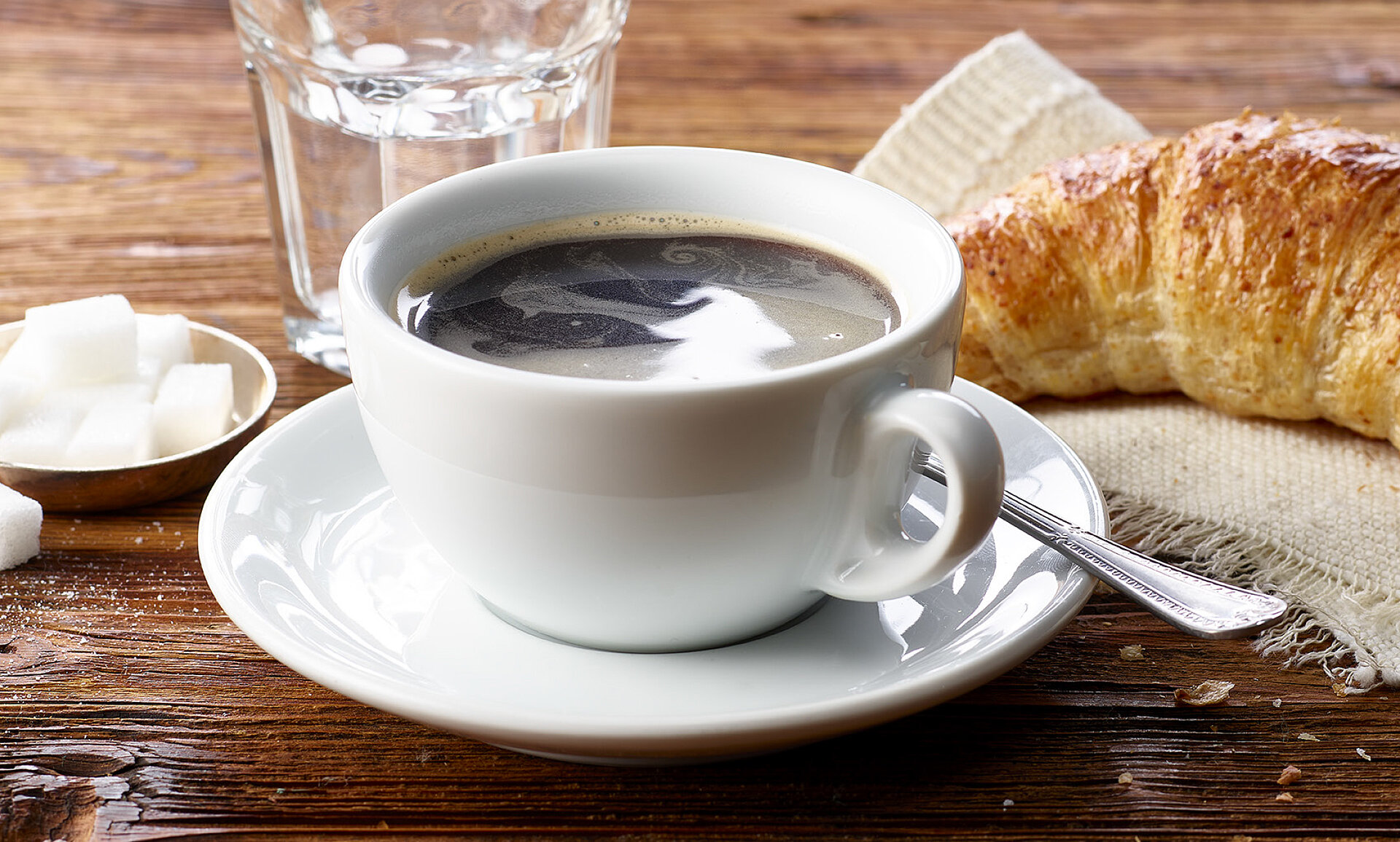 coffee and croissant on the table